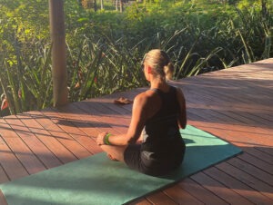 Noticing-Resistance-Woman-on-yoga-mat-on-marsh-boardwalk
