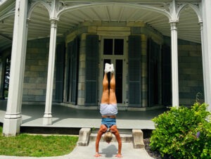 BE HERE - allison doing handstand inf ront fo arches