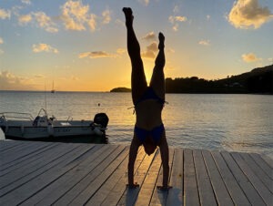 SO HUM - hand stand on pier yoga