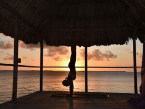 Feel your Feelings-handstand on a beach peer