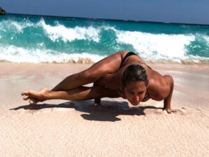 Allowing Pain In Allyson Yoga on the beach
